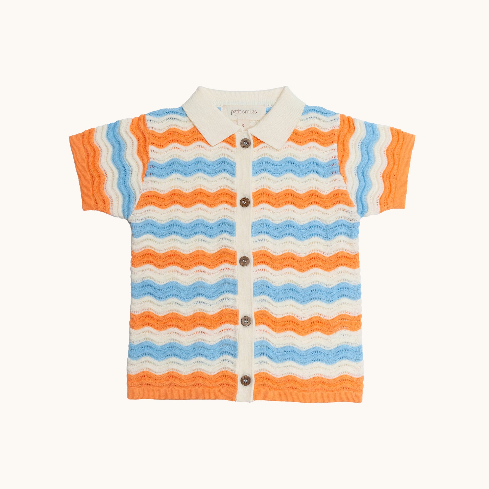 KNITTED WAVY SHORT-SLEEVED COTTON SHIRT - CORAL; 100% Organic Cotton; Short-sleeved Shirt made from GOTS-certified organic cotton; Open spread collar; Rib finish at neck, hem and cuffs; Coconut Shell Button closure; Dropped shoulder; Relaxed fit. 