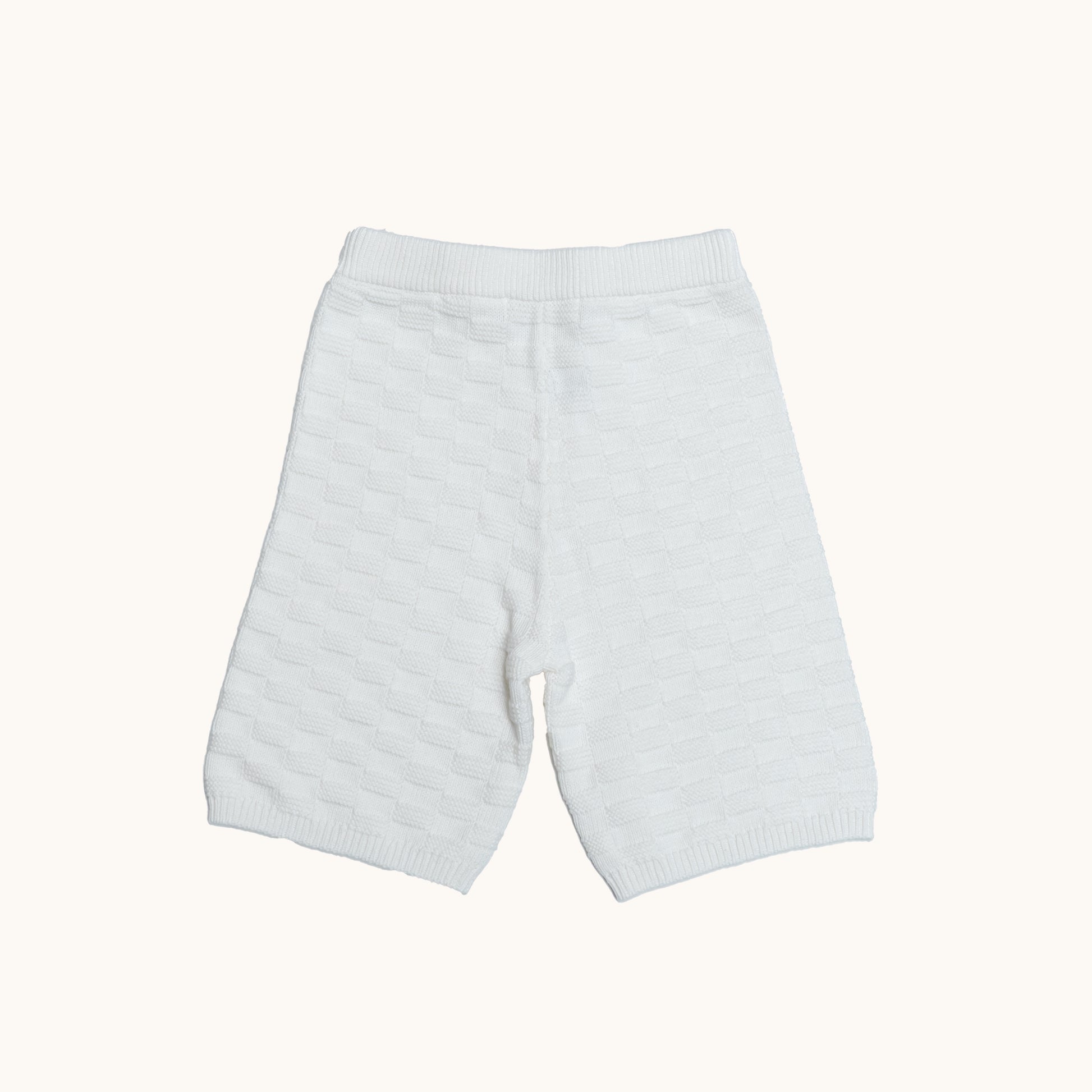 KNITTED BERMUDA SHORTS - CREAM; 100% Organic Cotton; Shorts made from GOTS-certified organic cotton; Elasticated waistband; Relaxed fit.