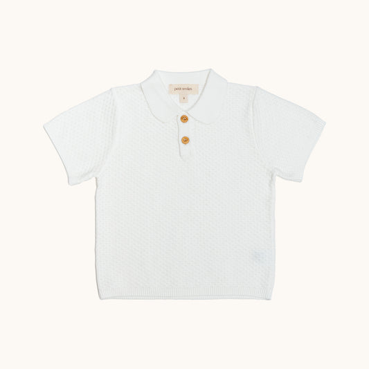 ORGANIC KNITTED SUMMER TEE - CREAM; 100% Organic Cotton; Summer Tee made from GOTS-certified organic cotton; Wooden button at front neck for easy dressing; Rib finish at hem and cuffs; Relaxed fit. 