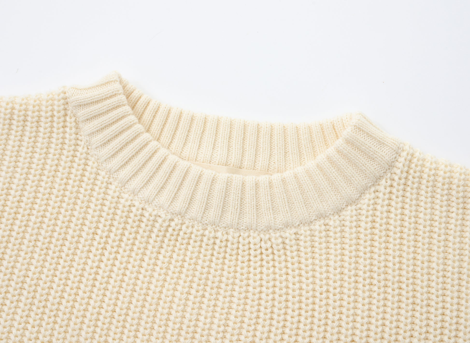 KNITTED PURE PULL OVER - CREAM; 100% Organic Cotton; Pull Over made from GOTS-certified organic cotton; Rib finish at neck, cuffs and hem; Dropped shoulder; Relaxed fit.