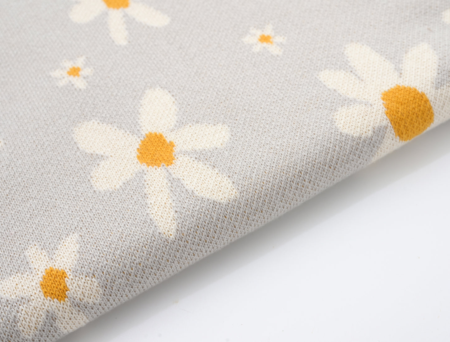 KNITTED FLORAL BABY BLANKET; 100% Organic Cotton; Jacquard Baby Blanket made from GOTS-certified organic cotton; 'FLORAL' Jacquard pattern; Rib finish at edges; 92cm x 72cm