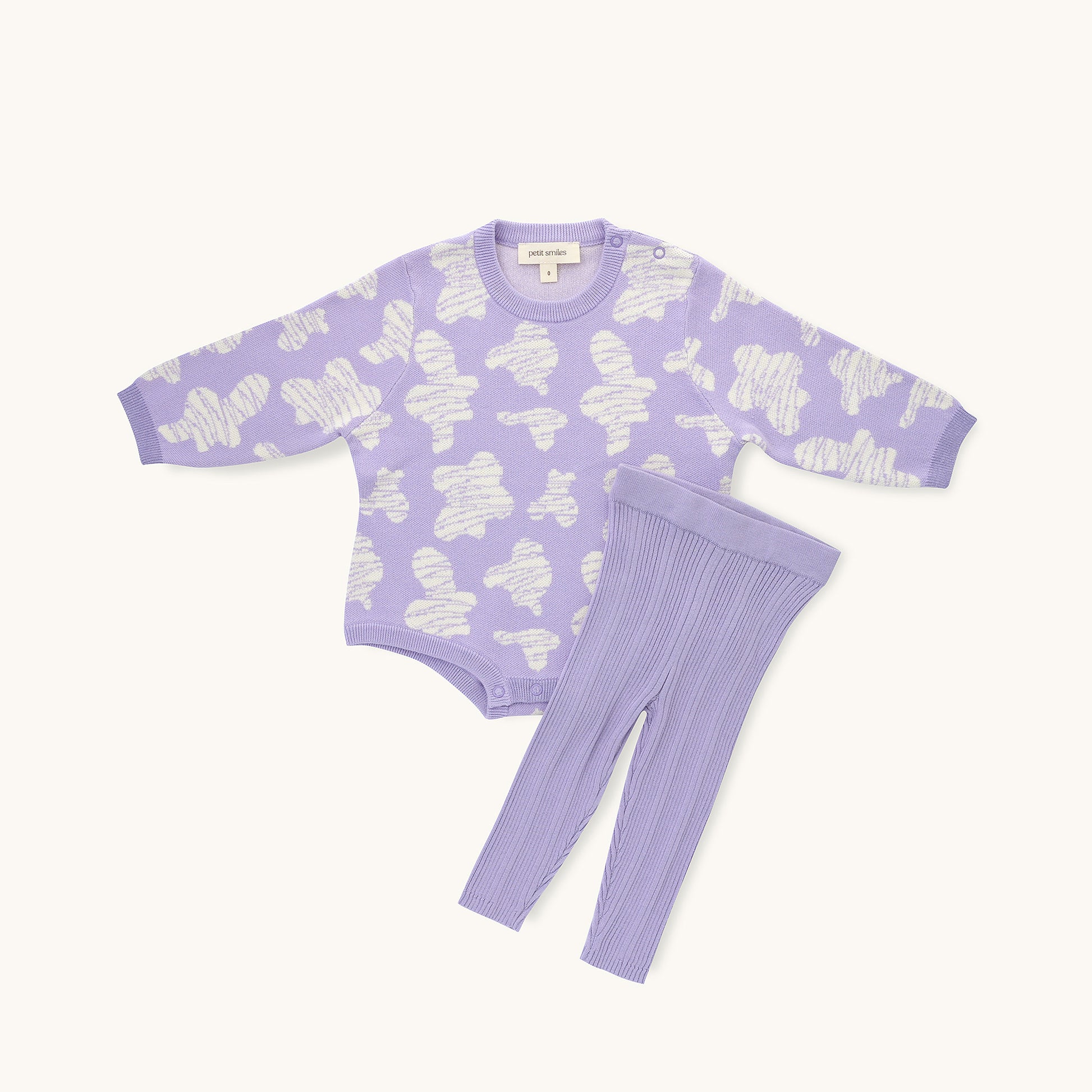 KNITTED SPOTS ROMPER - TARO; 100% Organic Cotton; Jacquard Romper made from GOTS-certified organic cotton; 'TARO SPOTS' Jacquard pattern; Rib hem at neck, cuffs and leg opening; Features convenient press snaps at the crotch for effortless dressing; Oversized fit.